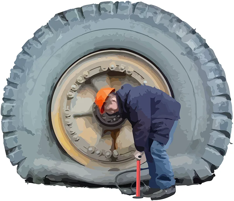 Worker inflating tire